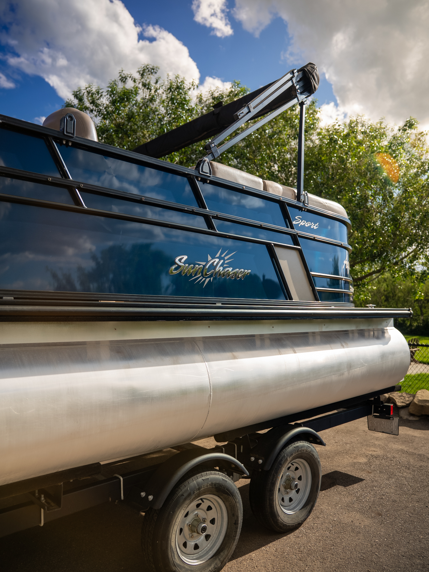 Mobile marine detailing on a pontoon boat at sunset