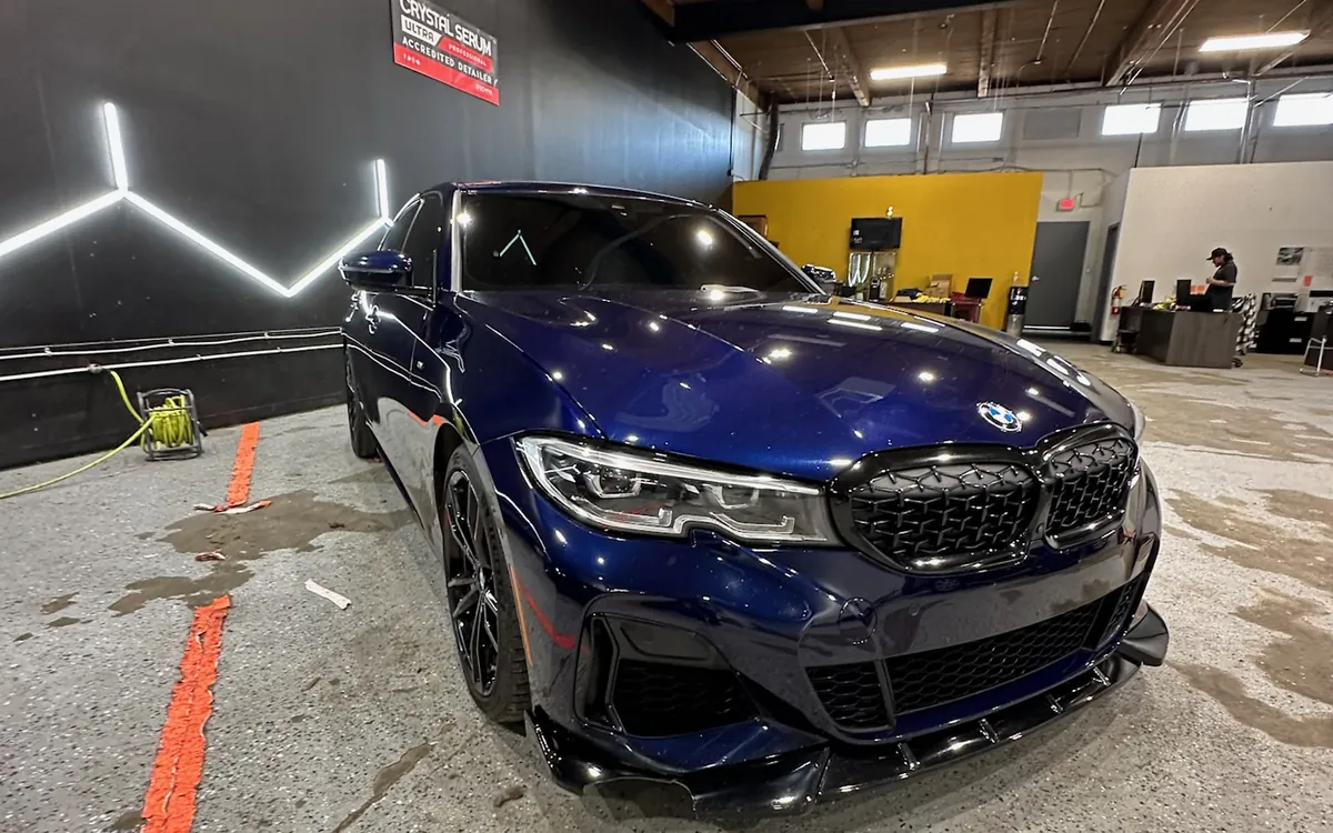 Blue BMW M340i in the shop after paint correction and ceramic coating
