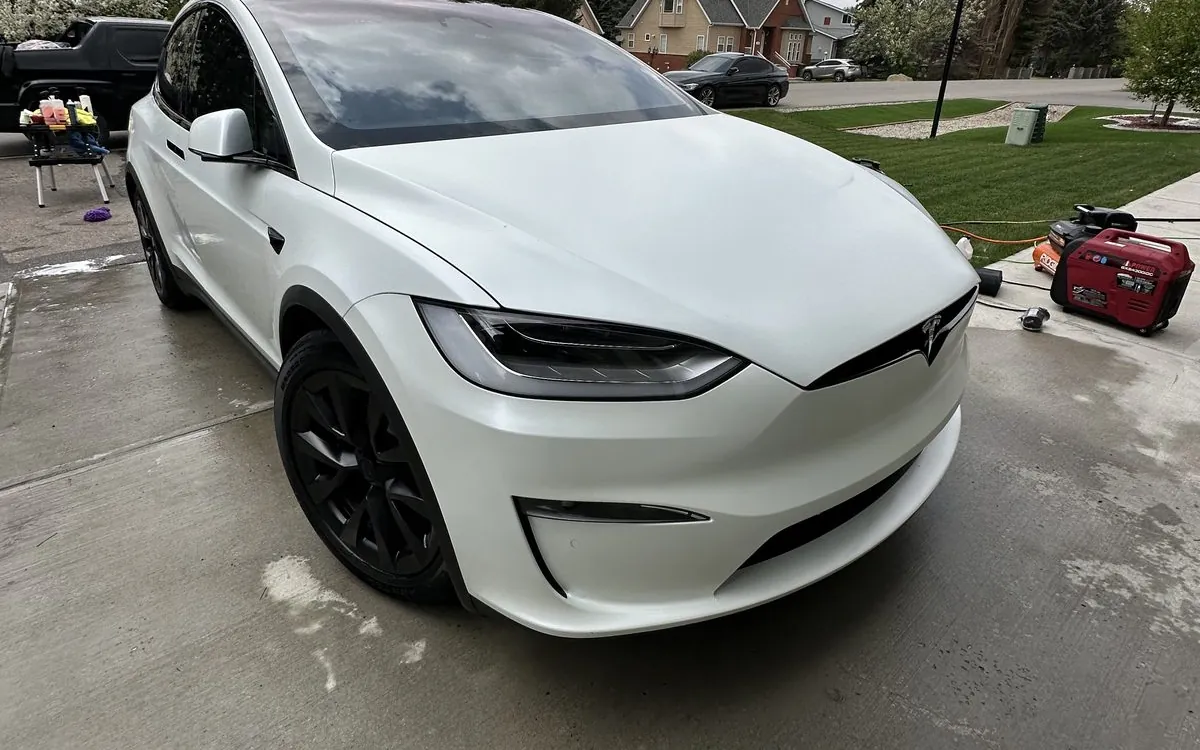 White Tesla Model X in a Calgary driveway after a maintenance detail