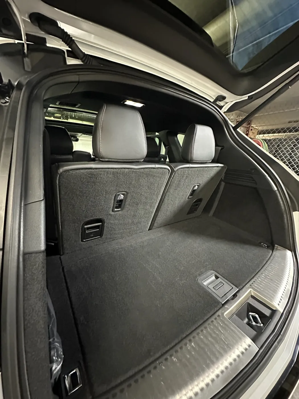Three-row SUV cargo area and third-row seats after a detail