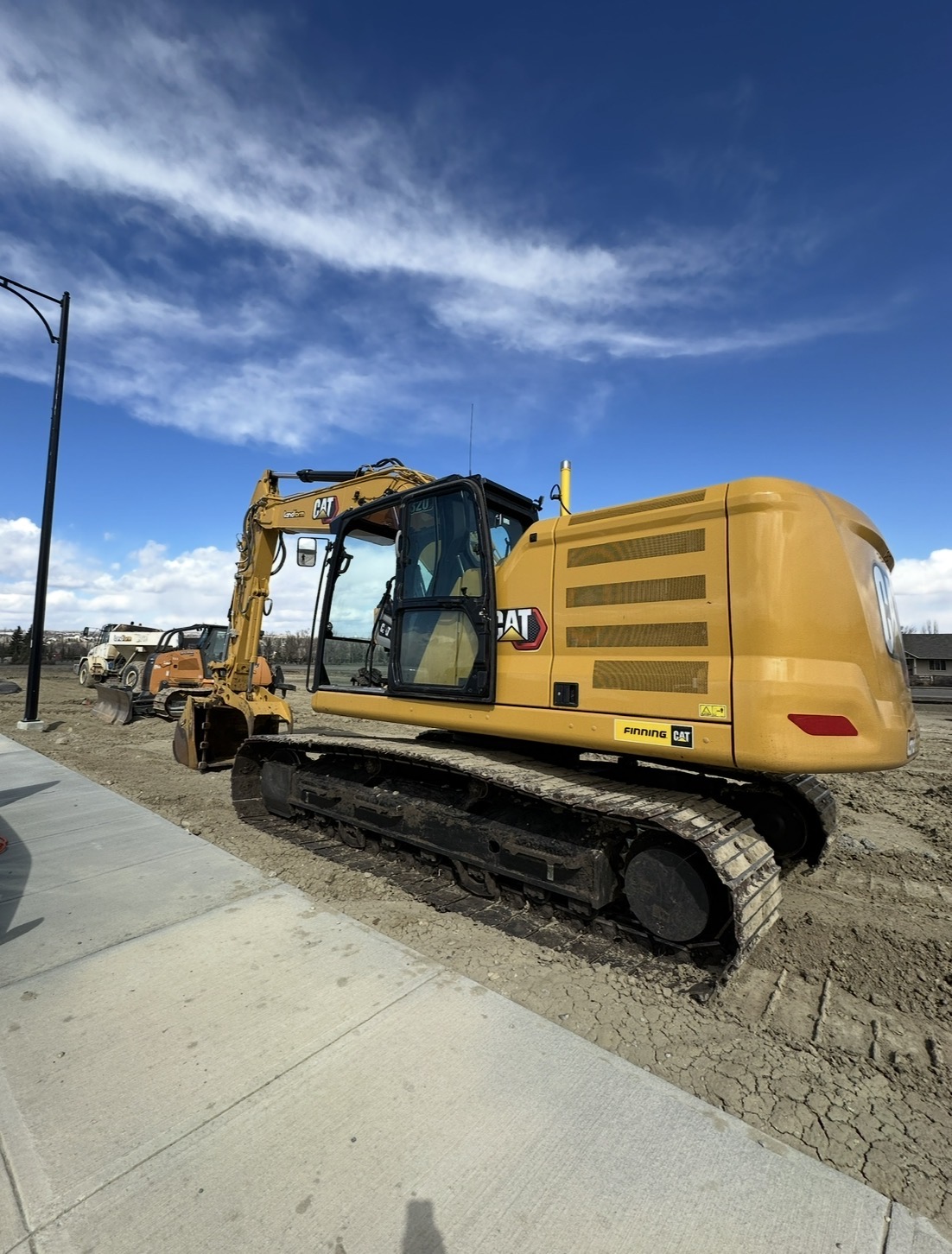 Cleaned excavator undercarriage and body panels